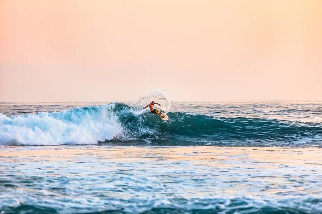 A surfer riding an open wave