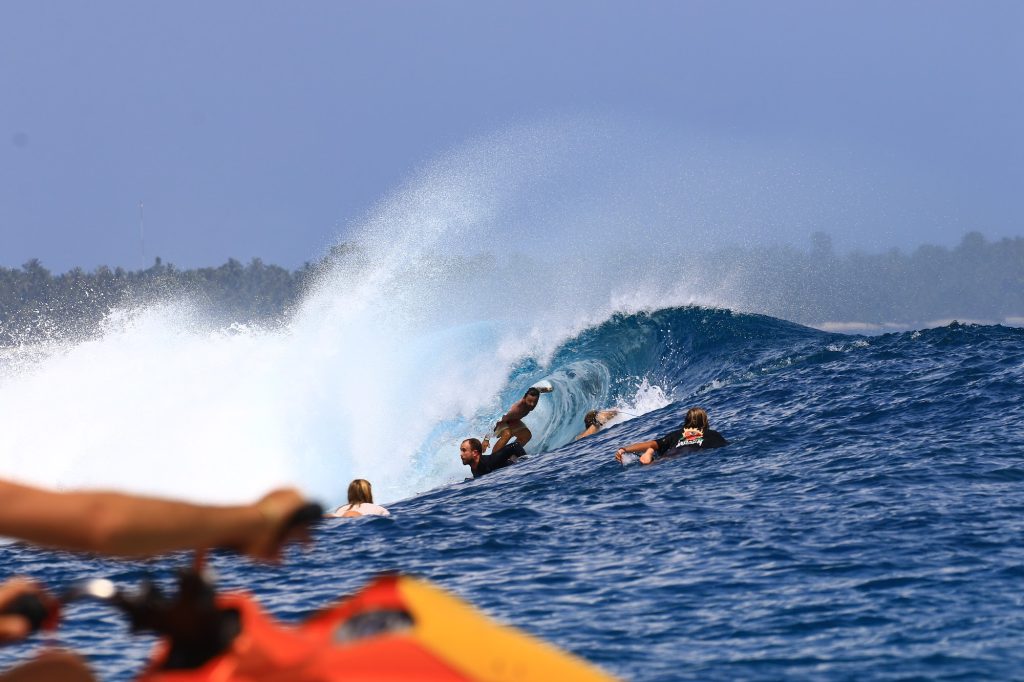 Surfer inside the barrel of a wave